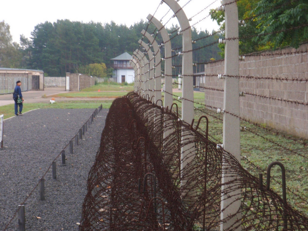 Guard Tower, Walls and Barbed Wire Fence.